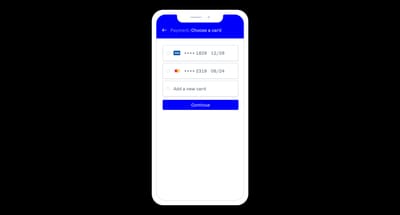 Checkout step listing previously saved credit cards, each showing the last four digits and the expiry date